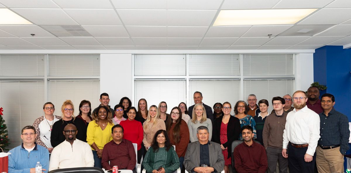 apvit team at an event posing for a picture